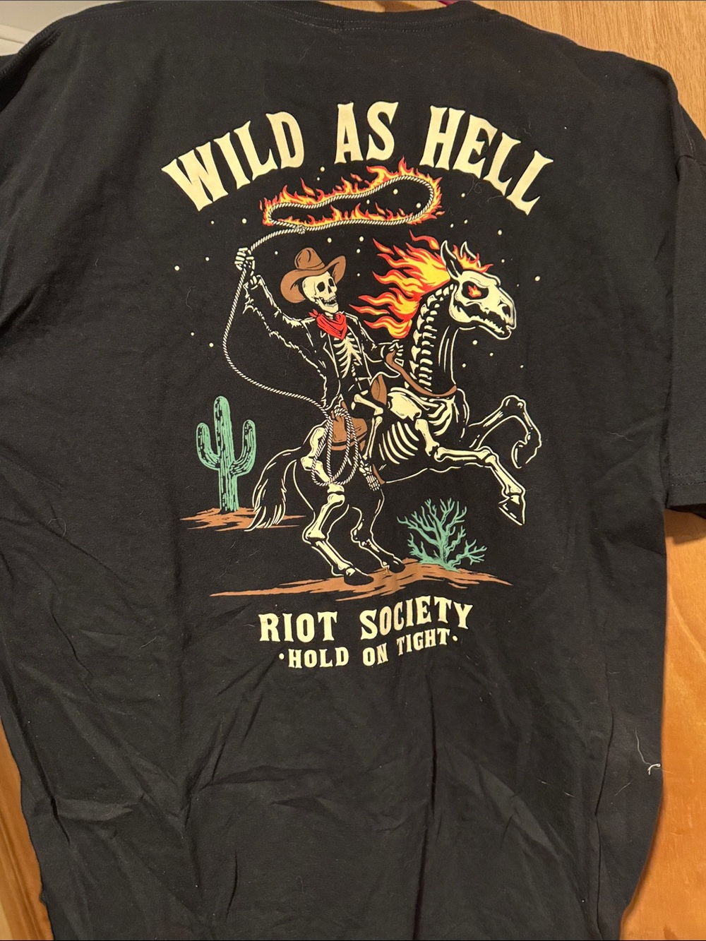 Riot Society Black Tee with Flaming Skeleton Cowboy Graphic